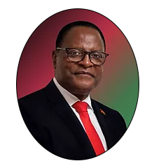 Dr. Lazarus M. Chakwera, the State President of the Republic of Malawi a stern looking man in a black suit and red tie wearing glasses.